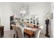 Dining room featuring a modern chandelier, elegant seating, and an open concept design at 1956 Nw 50Th Cir, Ocala, FL 34482