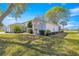 Well-maintained home with lush landscaping, decorative plants, and a charming architectural design at 1956 Nw 50Th Cir, Ocala, FL 34482