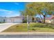 Charming single-story home with a three-car garage, mature landscaping, and a well-maintained lawn at 1956 Nw 50Th Cir, Ocala, FL 34482