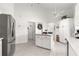 Bright kitchen with granite island, stainless appliances, and tile floor at 1956 Nw 50Th Cir, Ocala, FL 34482