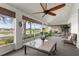 Relaxing lanai featuring comfortable seating, large windows, and peaceful water views at 1956 Nw 50Th Cir, Ocala, FL 34482
