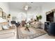 Bright living room with vaulted ceilings, comfortable seating, and an open layout at 1956 Nw 50Th Cir, Ocala, FL 34482
