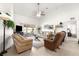 Spacious living room featuring comfortable seating, neutral tones, and an open concept design at 1956 Nw 50Th Cir, Ocala, FL 34482