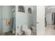 Light and bright bathroom with a tiled floor, white fixtures, and a white door at 20280 Sw 69Th Pl, Dunnellon, FL 34431