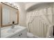Cozy bathroom with tiled flooring, sink and vanity, and shower with curtain at 20280 Sw 69Th Pl, Dunnellon, FL 34431