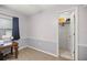 View of a bedroom with neutral tone walls, carpeting, and a closet with open door at 20280 Sw 69Th Pl, Dunnellon, FL 34431