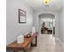 Inviting foyer with tile floors, console table, and a view into the living area at 20280 Sw 69Th Pl, Dunnellon, FL 34431