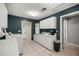 Laundry room featuring bright cabinets, a sink, and washer and dryer hookups at 20280 Sw 69Th Pl, Dunnellon, FL 34431