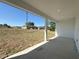 Covered patio with view of the expansive backyard at 2602 Sw 154Th Ln, Ocala, FL 34473