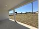 Covered patio with view of the expansive backyard at 2602 Sw 154Th Ln, Ocala, FL 34473