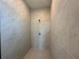 A shower is tiled in neutral colors from the base to the walls, with a shower head and temperature knob at 2602 Sw 154Th Ln, Ocala, FL 34473