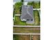 Aerial view of home with spacious fenced yard, brick patio and green lawn at 4241 Sw 62Nd Loop, Ocala, FL 34474