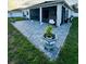 A spacious brick patio with comfortable lounge seating, a ceiling fan, and attractive potted plants at 4241 Sw 62Nd Loop, Ocala, FL 34474