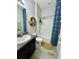 Bathroom featuring vanity with stone counter, shower-tub combo, and linen closet at 4241 Sw 62Nd Loop, Ocala, FL 34474