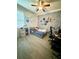 Cozy bedroom featuring unique wall decor and comfortable furnishings for relaxation at 4241 Sw 62Nd Loop, Ocala, FL 34474
