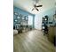 Bedroom with wood-look flooring, plenty of light, and versatile storage at 4241 Sw 62Nd Loop, Ocala, FL 34474