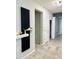 Hallway showcasing modern decor, floating shelves, and easy access to other rooms at 4241 Sw 62Nd Loop, Ocala, FL 34474