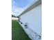 Side of home showcases meticulous landscaping and tasteful potted plants along the wall at 4241 Sw 62Nd Loop, Ocala, FL 34474