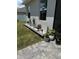 Landscaped side yard featuring colorful flower arrangements and lush green lawn at 4241 Sw 62Nd Loop, Ocala, FL 34474