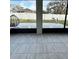 A covered patio shows a view of the backyard and fence; tiled floor and decorative accents at 4241 Sw 62Nd Loop, Ocala, FL 34474