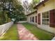 Home exterior with a tiled roof and shutters, complimented by a well-maintained lawn and garden area at 4301 Se 6 Ave, Ocala, FL 34480