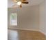 Bright empty room with a ceiling fan, tile flooring, and a window allowing for lots of natural light at 4301 Se 6 Ave, Ocala, FL 34480