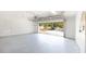 Spacious garage with an open door, showing an inviting view of the home's exterior and the neighborhood at 4301 Se 6 Ave, Ocala, FL 34480