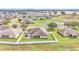 Aerial view of a home featuring a lovely backyard with a stone patio and a well-maintained green lawn at 4839 Sw 63Rd St, Ocala, FL 34474