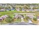 An aerial view of the house showcasing a well-maintained front yard, driveway, and the surrounding neighborhood at 4839 Sw 63Rd St, Ocala, FL 34474