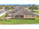 Spacious backyard featuring a stone firepit, patio seating area, and a well-kept lawn at 4839 Sw 63Rd St, Ocala, FL 34474