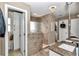 The primary bathroom features a walk-in shower, tiled floors, a granite countertop, and white cabinets at 4839 Sw 63Rd St, Ocala, FL 34474