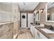 This bathroom is fully equipped with granite countertops, a walk-in shower, and double sinks at 4839 Sw 63Rd St, Ocala, FL 34474