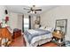 Comfortable bedroom featuring hardwood floors, a ceiling fan, and a queen-sized bed at 4839 Sw 63Rd St, Ocala, FL 34474