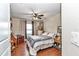 Cozy bedroom featuring hardwood floors, a ceiling fan, and a comfortable queen-sized bed at 4839 Sw 63Rd St, Ocala, FL 34474