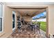 Covered patio with a ceiling fan, comfortable seating, and a hammock, ideal for enjoying outdoor living at 4839 Sw 63Rd St, Ocala, FL 34474