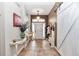 Spacious foyer featuring tile floors, decorative table, and a stylish barn door for added charm at 4839 Sw 63Rd St, Ocala, FL 34474