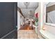 Open entryway with tile flooring, leading to a view of the living area and rustic barn door at 4839 Sw 63Rd St, Ocala, FL 34474