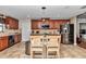 Open concept kitchen featuring stainless steel appliances and a granite island with seating at 4839 Sw 63Rd St, Ocala, FL 34474