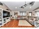 Comfortable living room with a large sectional couch, modern entertainment center, and soft rug at 4839 Sw 63Rd St, Ocala, FL 34474