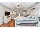 Spacious main bedroom features a ceiling fan, tray ceiling, and white dressers at 4839 Sw 63Rd St, Ocala, FL 34474