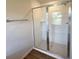 The bathroom features a glass enclosed tiled shower at 5646 Sw 129Th Place Rd, Ocala, FL 34473