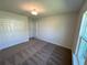 This bedroom has a window and closet at 5646 Sw 129Th Place Rd, Ocala, FL 34473