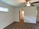 This bedroom features neutral walls, a ceiling fan, and carpeted floors at 5646 Sw 129Th Place Rd, Ocala, FL 34473