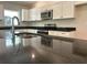 Modern kitchen boasts stainless steel appliances, granite countertops, and plenty of cabinet space at 5646 Sw 129Th Place Rd, Ocala, FL 34473