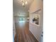 Open floorplan showcasing hardwood flooring, kitchen, and natural light. Ready for entertaining at 5646 Sw 129Th Place Rd, Ocala, FL 34473