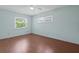 Bedroom with natural light showcases hardwood floors and is lit by a ceiling fan at 8430 Sw 90Th Ln # A, Ocala, FL 34481