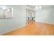 Dining room with hardwood floors and decorative pillars into entry at 8430 Sw 90Th Ln # A, Ocala, FL 34481