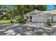 Charming single-story home featuring a wide driveway and lovely landscaping at 8430 Sw 90Th Ln # A, Ocala, FL 34481