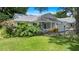 Charming single-story home featuring a well-manicured lawn and vibrant landscaping at 8430 Sw 90Th Ln # A, Ocala, FL 34481