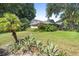 Home featuring lush landscaping, mature trees, and a well-manicured lawn at 8430 Sw 90Th Ln # A, Ocala, FL 34481